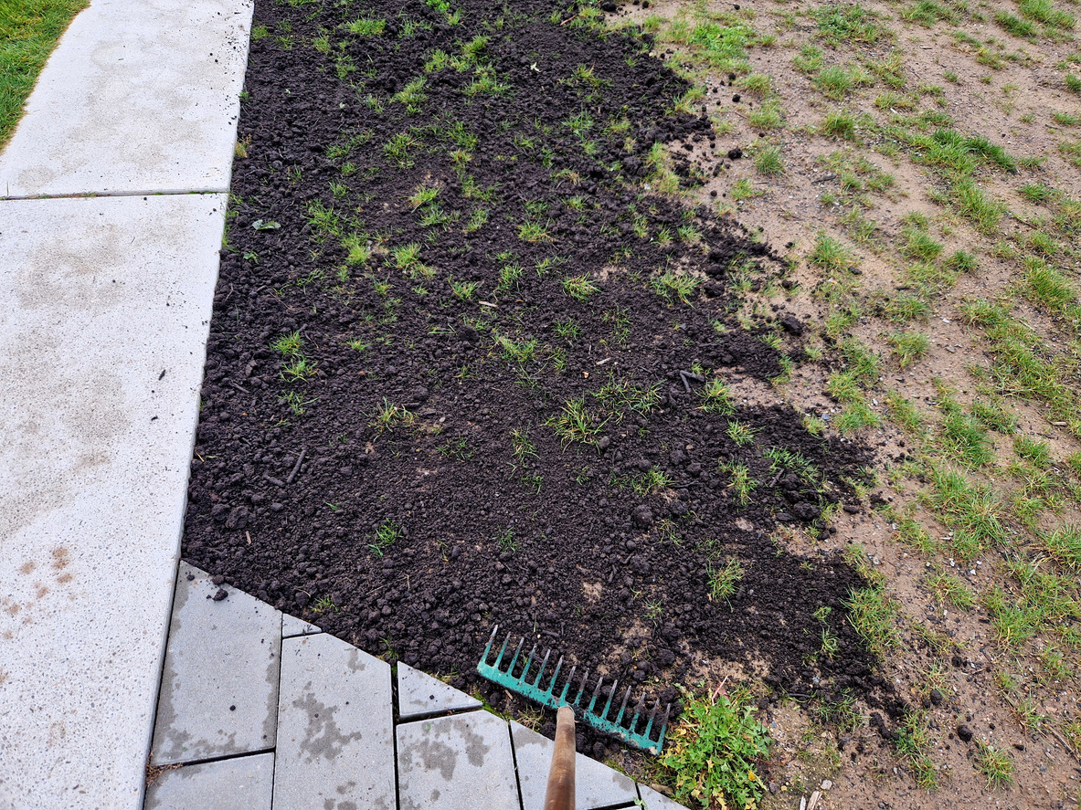 photo of a lawn top dressing being applied
